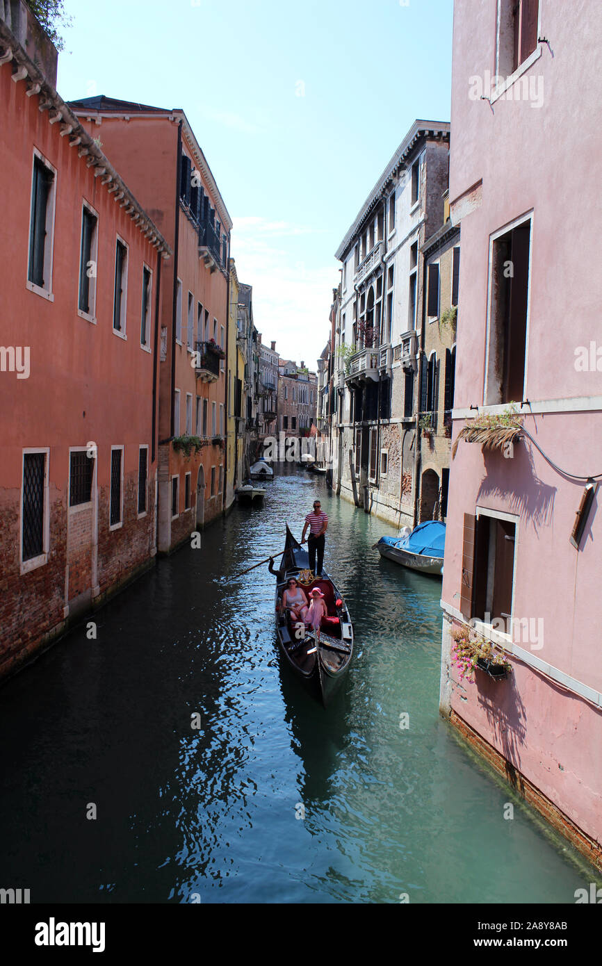 Gondola on side canal in Venice Stock Photo