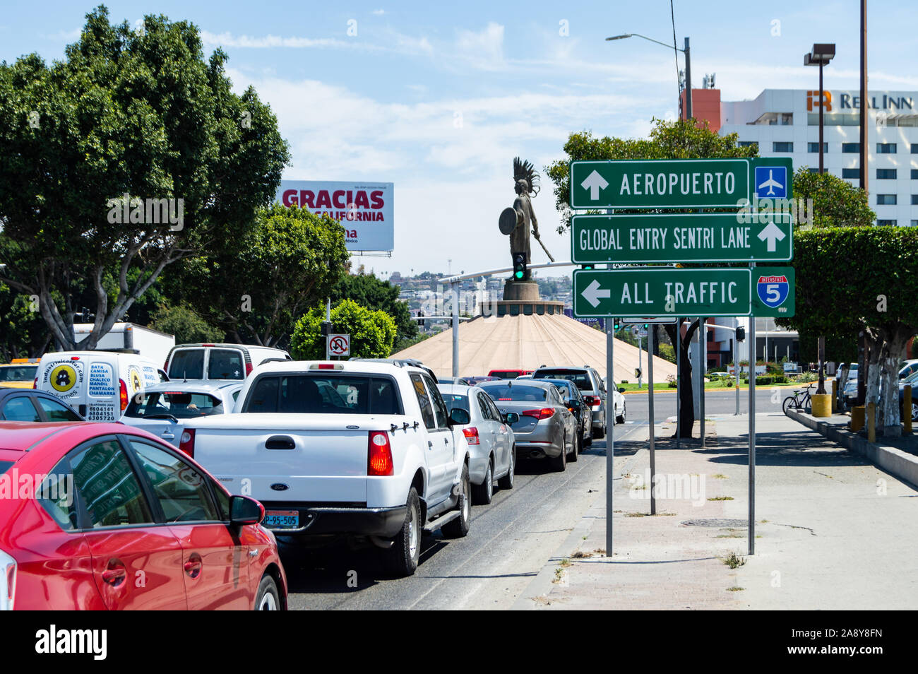 TIJUANA, MEXICO - 07/22: Tijuana traffic on the Cuauhtémoc roundabout in the river zone (Zona Rio). The statue in the middle is Cuauhtémoc, the last A Stock Photo