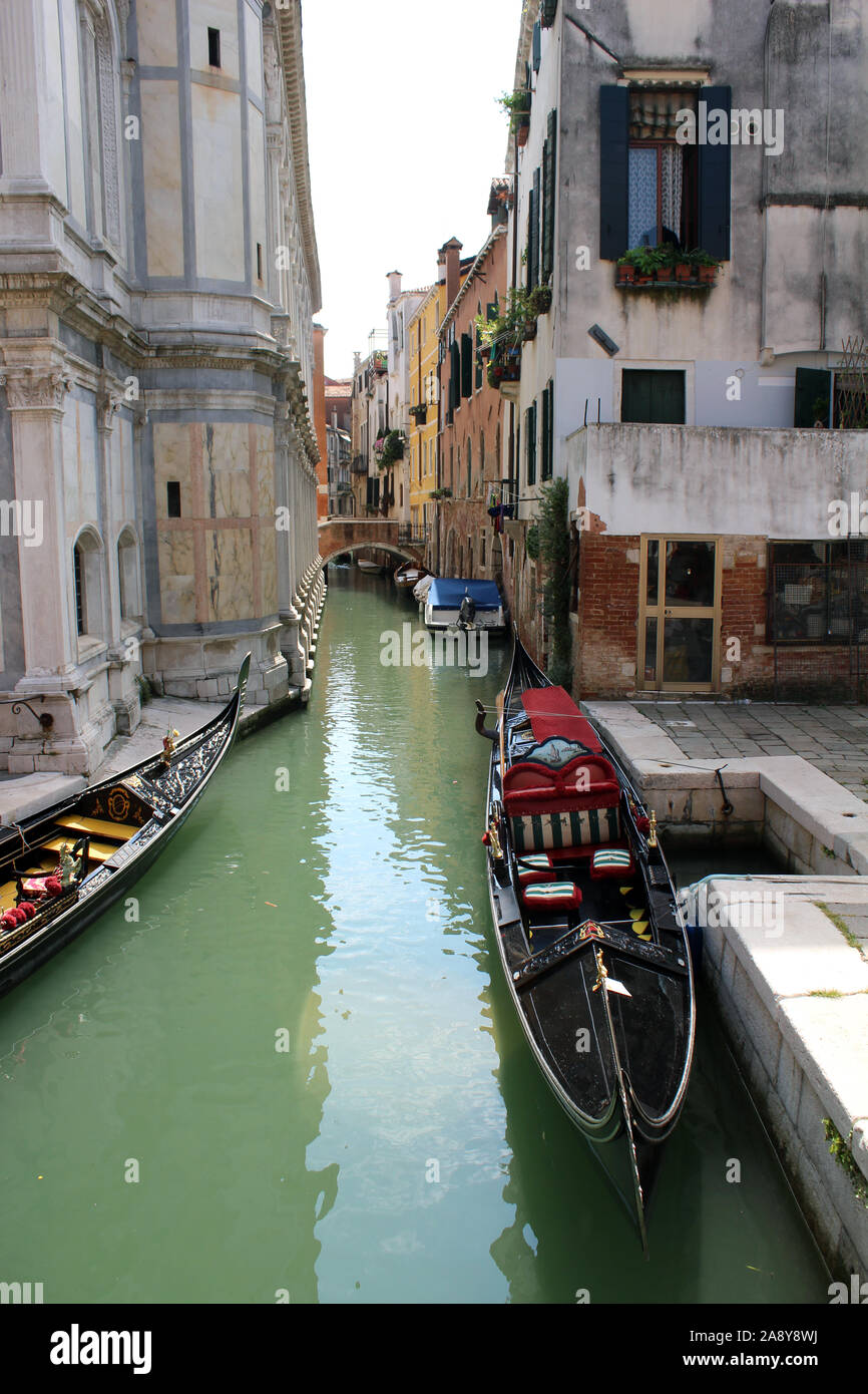 Gondola on side canal in Venice Stock Photo