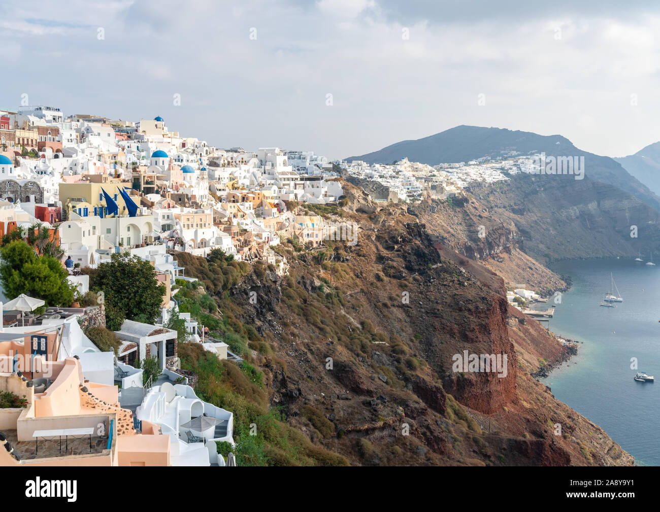 1st Nov 2019 - Santorini, Greece. Whitewashed buildings in Oia village situated high on the rock above Aegean sea. Stock Photo