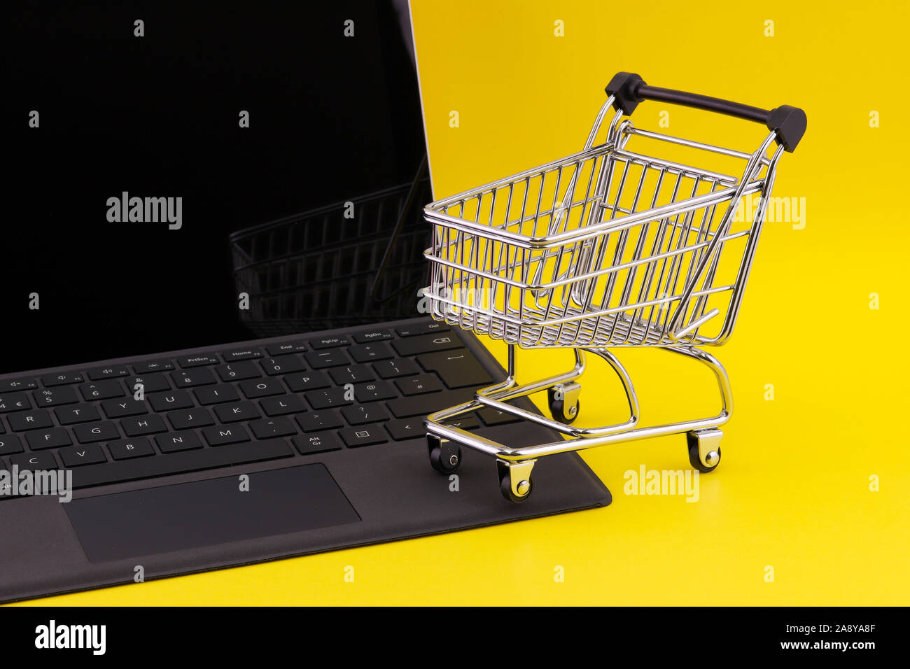 Internet shopping concept of a laptop computer with a mini shopping ...