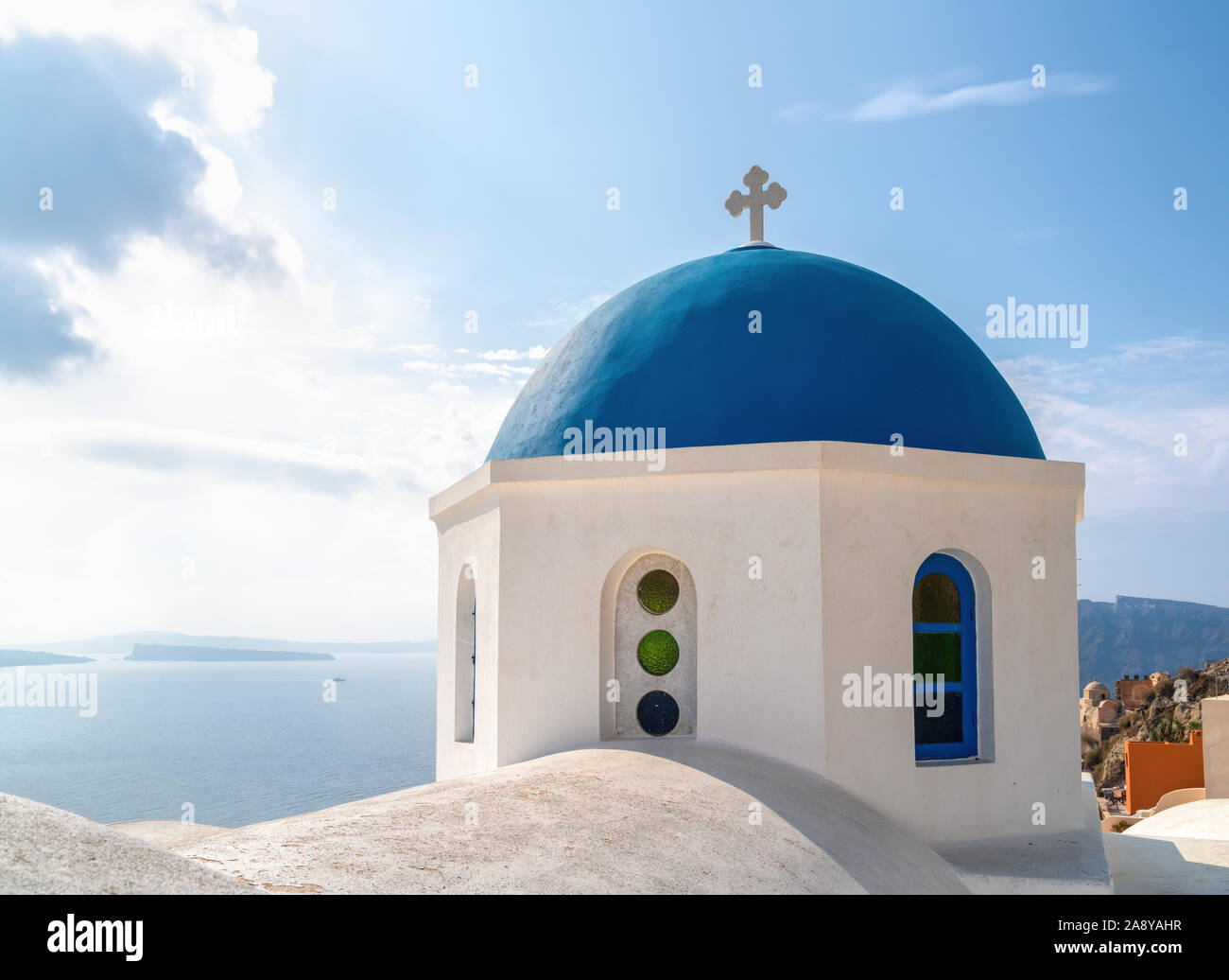 An orthodox church with blue dome and whitewashed walls located in the village of Oya in Santorini, Greece. Stock Photo
