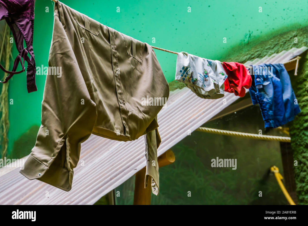 clean laundry hanging to dry on a wash line, natural drying method Stock Photo
