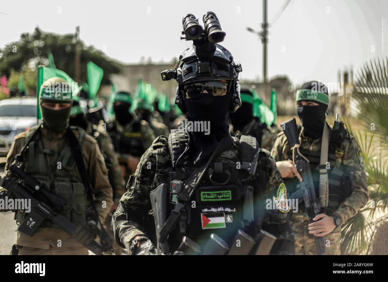 Hamas gunmen march with their weapons in Khan Younis, southern Gaza Strip.Izz el-Deen al-Qassam Brigades, the armed wing of Palestinian resistance movement Hamas, hold an anti-Israel military show in the southern Gaza Strip as part of the anniversary of the prevention of Israeli covert operation carried out in the Khan Younis on 11 November 2018. Stock Photo