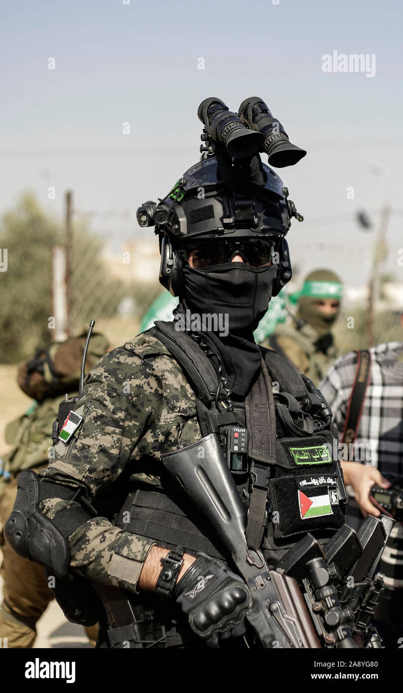 Hamas gunmen march with their weapons in Khan Younis, southern Gaza Strip.Izz el-Deen al-Qassam Brigades, the armed wing of Palestinian resistance movement Hamas, hold an anti-Israel military show in the southern Gaza Strip as part of the anniversary of the prevention of Israeli covert operation carried out in the Khan Younis on 11 November 2018. Stock Photo