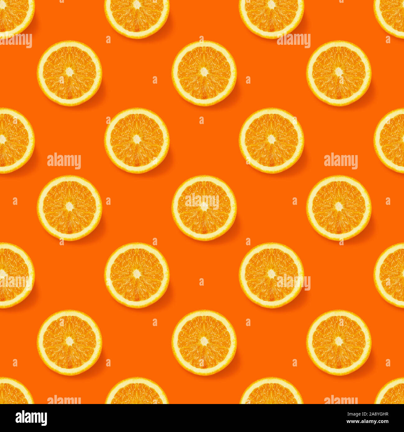 Seamless  pattern with oranges slices on orange background. Flat lay, top view. Creative  concept. Isometric view. Stock Photo