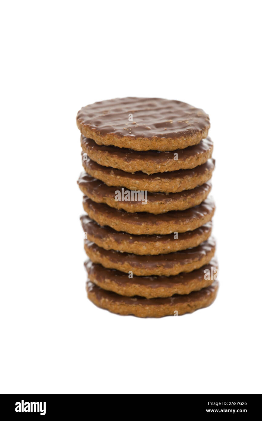 Chocolate biscuit pile on isolated white background Stock Photo