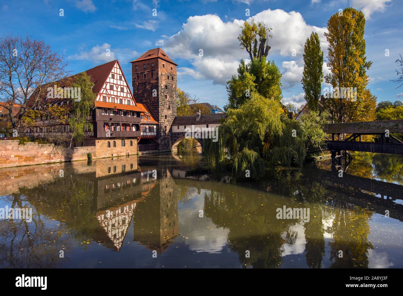 The beautiful view over the Pegnitz river towards Weinstadel House, Hangmans Tower and the Henkersteg, or Hangmans Bridge, in Nuremberg, Germany. Stock Photo