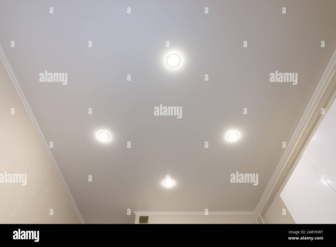 Ceiling in the kitchen, with four spotlights installed and turned on
