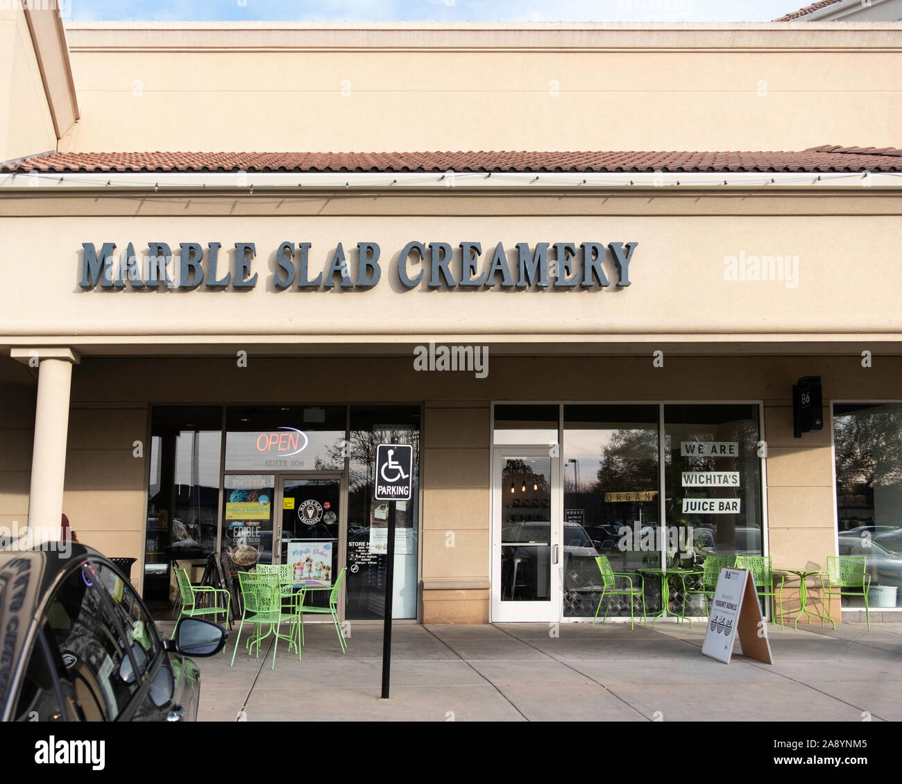Marble slab Creamery shopfront and  window sign advertising a juice bar. Wichita, Kansas, USA. Stock Photo