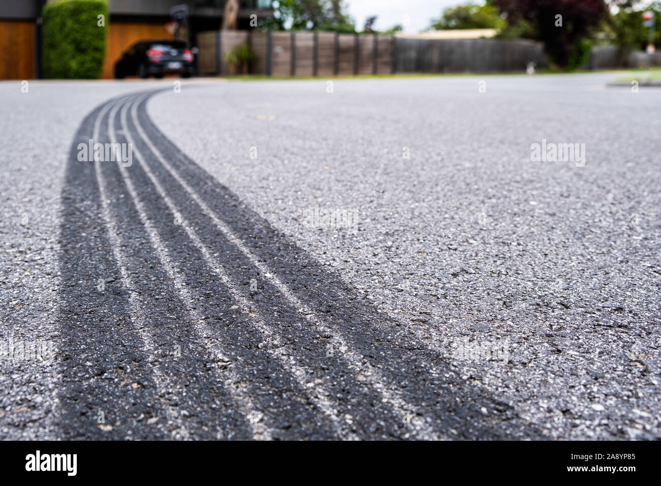 Tyre track on asphalt from hard braking - shallow focus Stock Photo