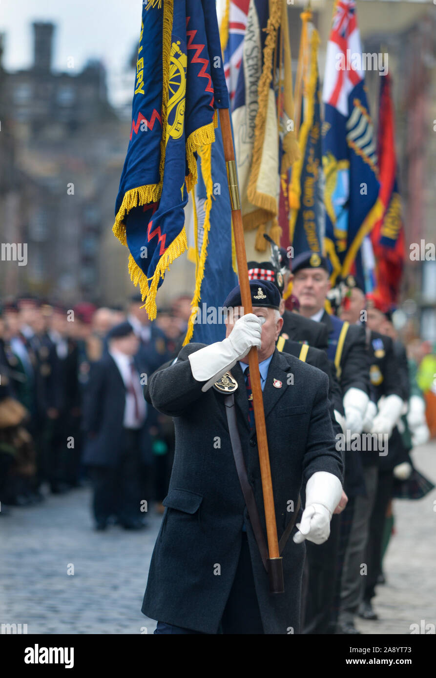 Standard Bearers from ex Armed Forces Associations marching during Remembrance Day commemorations on Edinburghs' Royal Mile Stock Photo