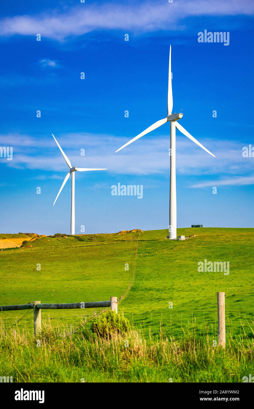 Wind turbines on farm properties at Cape Nelson in Victoria, Australia Stock Photo