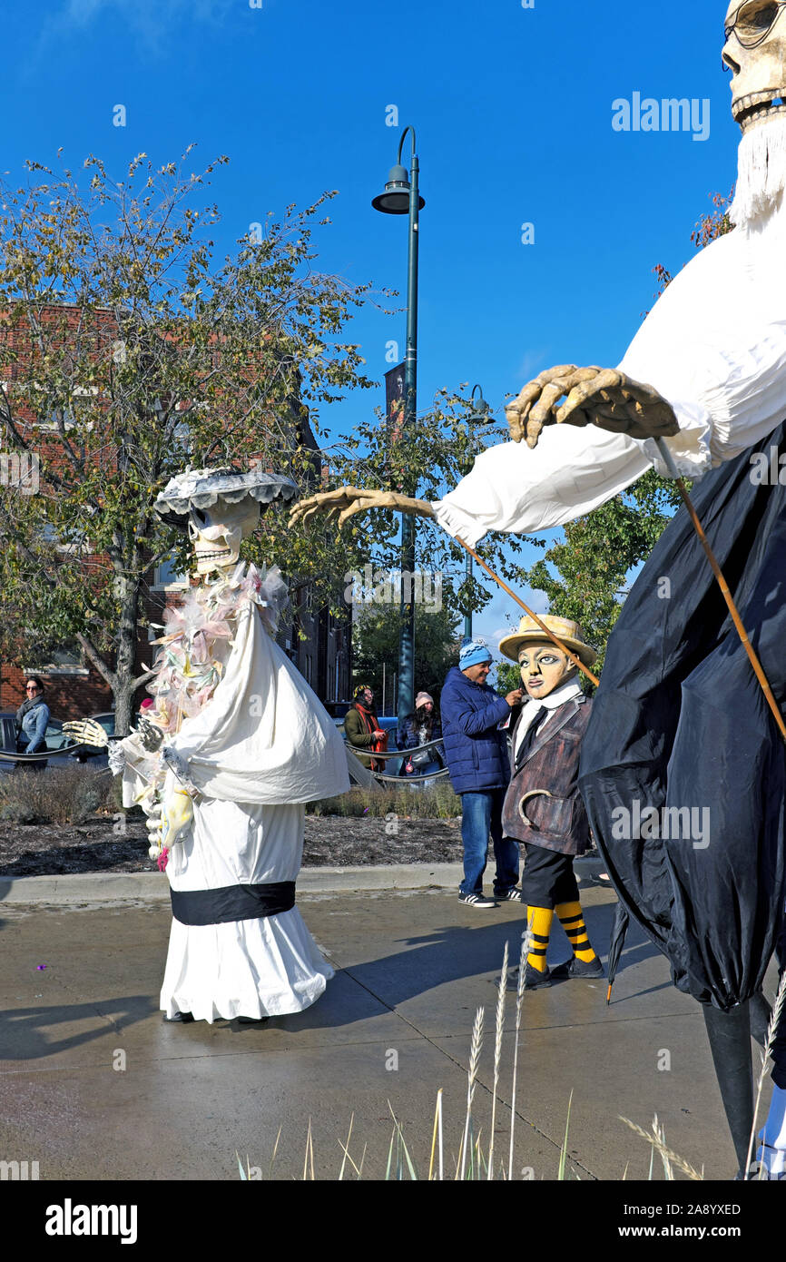 Larger-than-life costumed participants parade in the 2019 Day of the Dead celebration in Cleveland, Ohio, USA. Stock Photo
