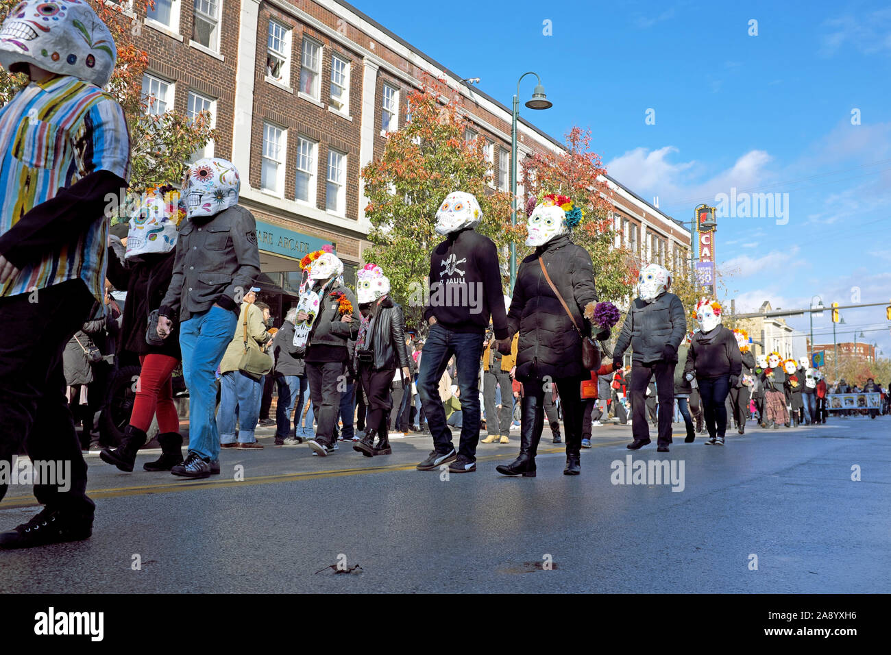 Masked participants in the annual Day of the Dead celebration parade down Detroit Avenue in the Detroit-Shoreway neighborhood in Cleveland, Ohio. Stock Photo