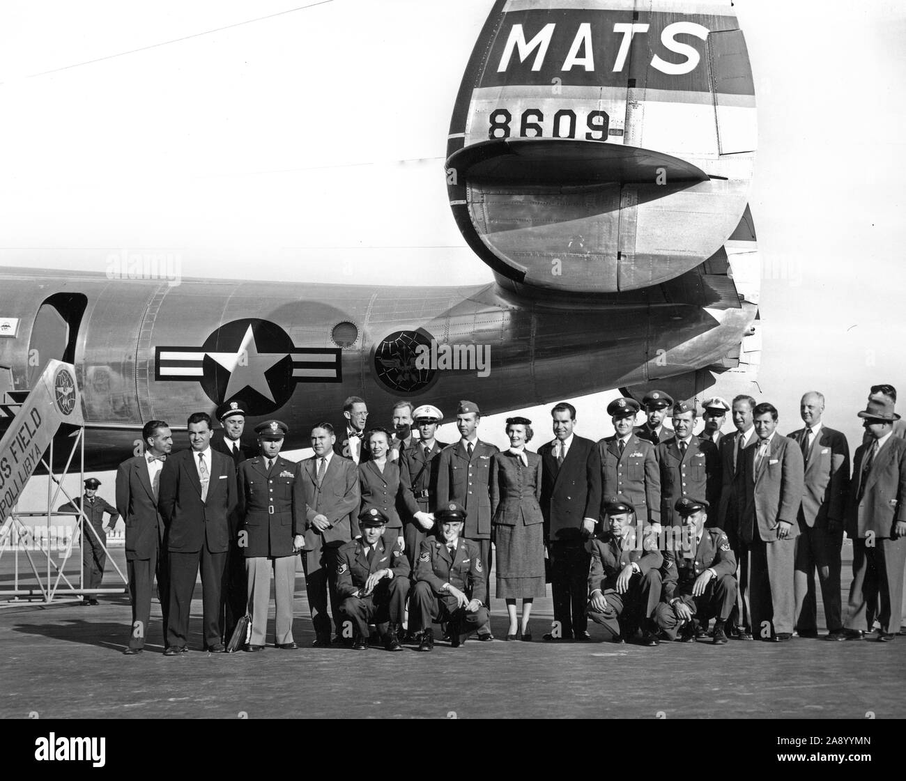 Vice President Richard Nixon, Pat Nixon, and flight crew stand in front of a military transport aircraft in Tripoli, Libya ca. 1953 Stock Photo