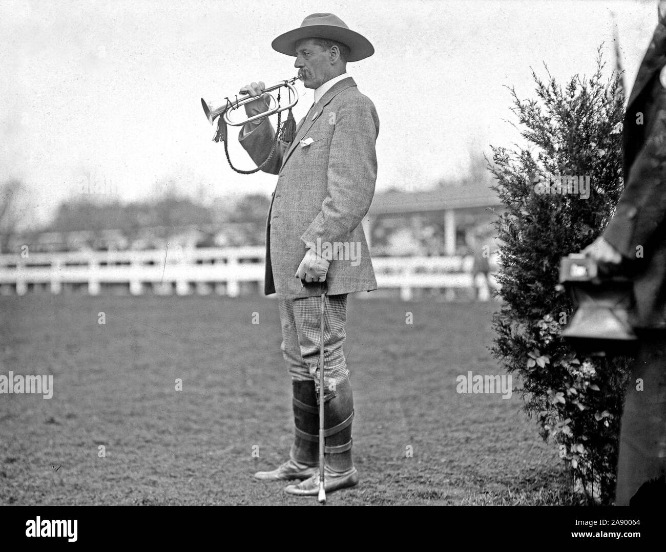 Horse show starter bugler (man blowing bugle) ca. 1911 Stock Photo
