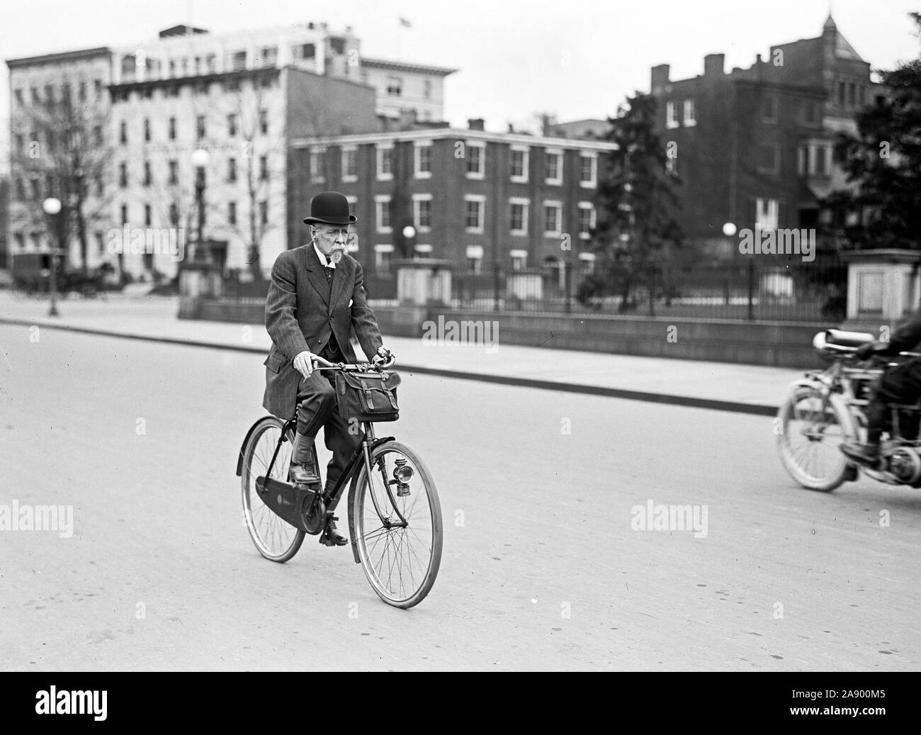 Riding his bicycle Black and White Stock Photos & Images - Alamy