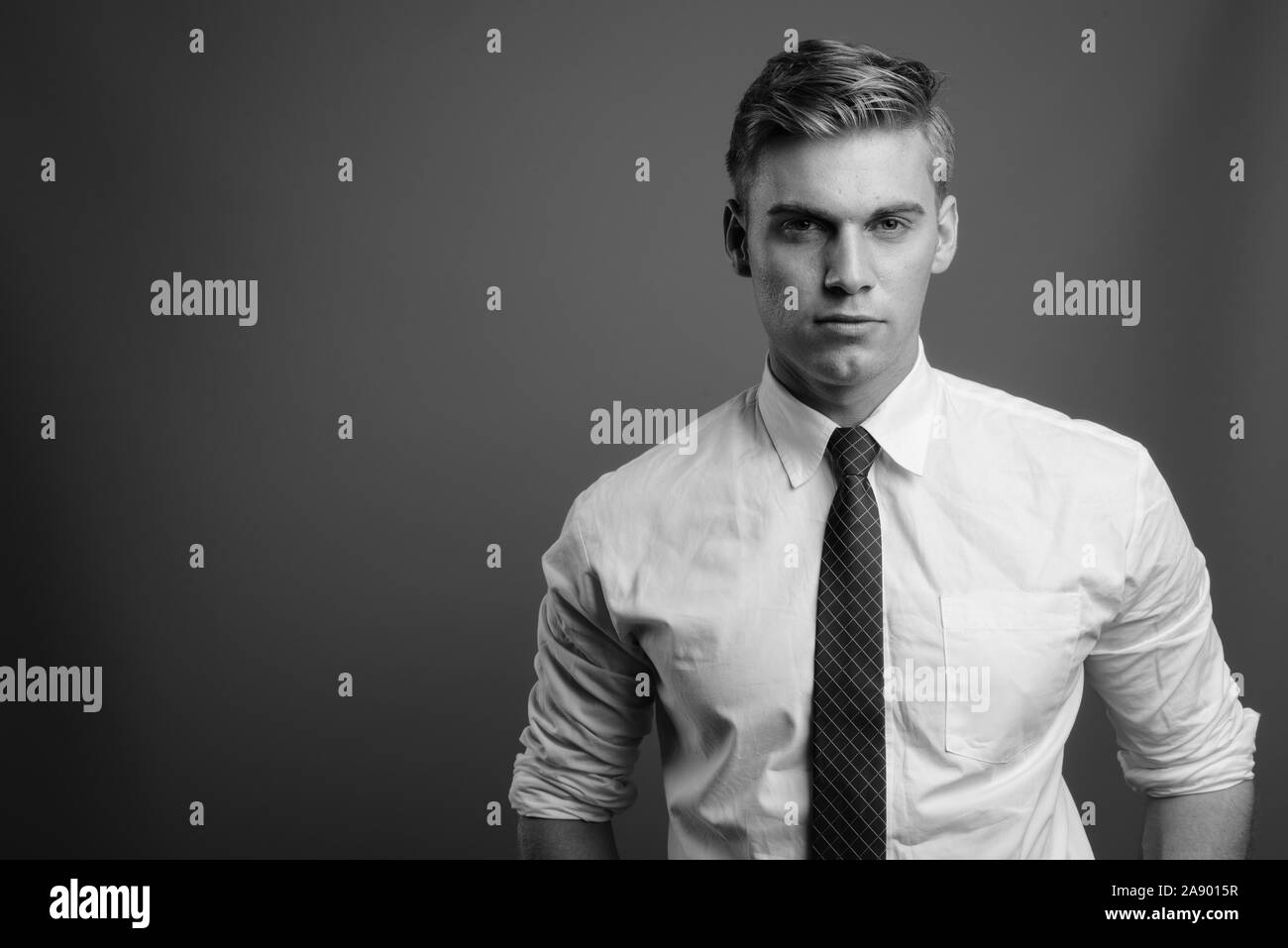 Face of young handsome businessman in black and white Stock Photo - Alamy