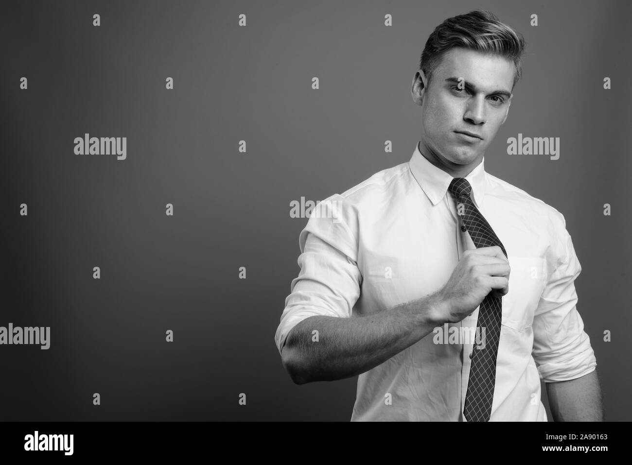 Portrait of young handsome businessman in black and white Stock Photo ...