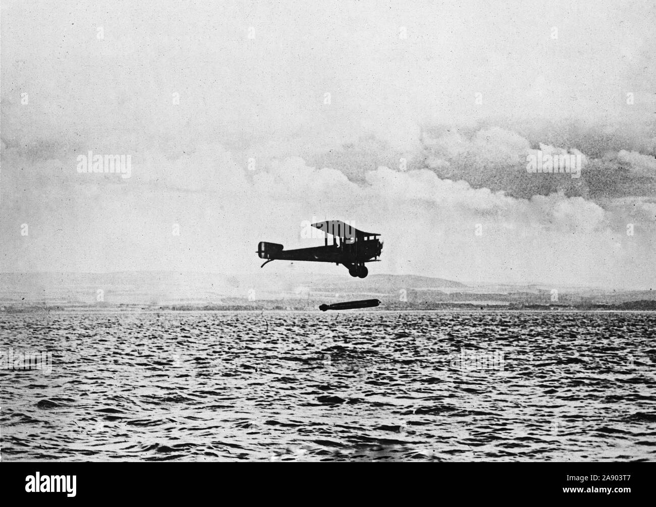British torpedo carrying airplane. Plane in the act of dropping a bomb- at the time of the cessation of hostilities England had a number of these torpedo carrying aeroplanes completed and ready for use Stock Photo