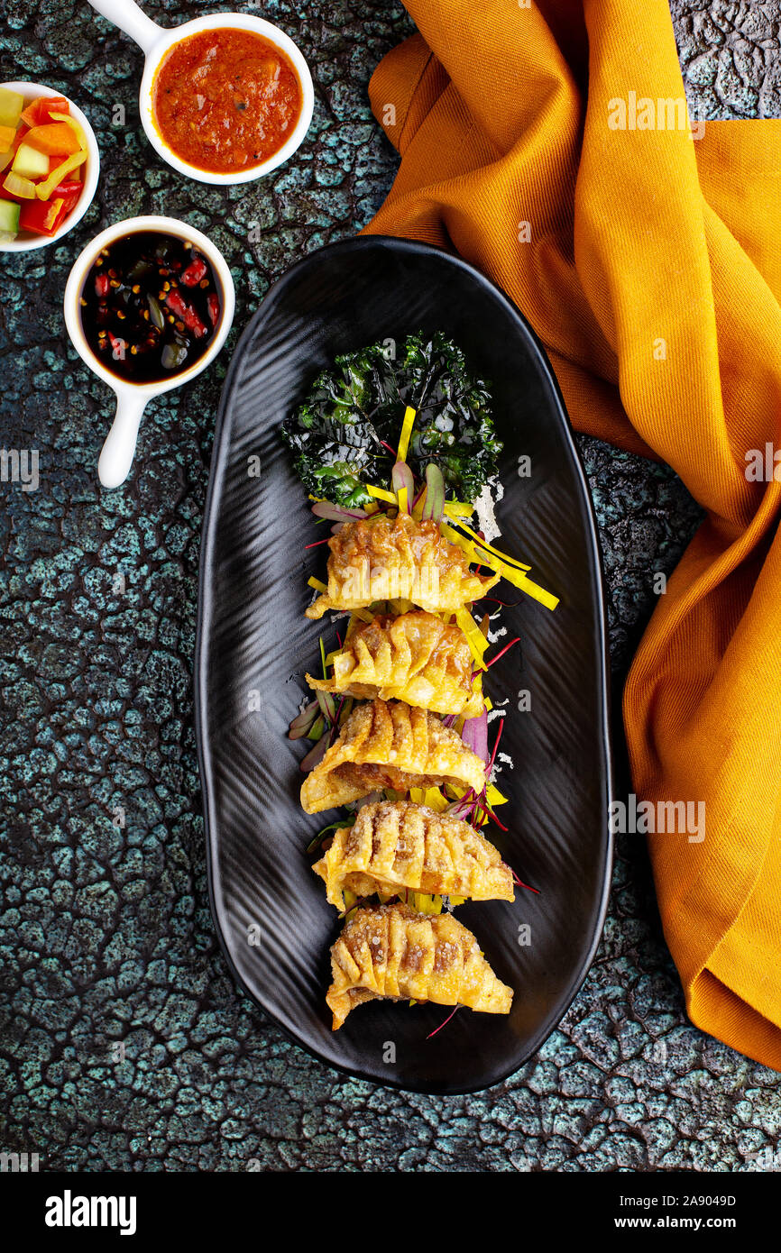 Deep fried potstickers or dumplings with dipping sauces Stock Photo Alamy