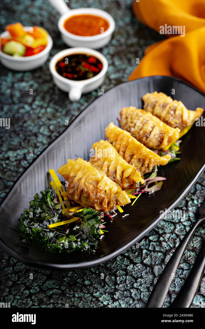 Deep fried potstickers or dumplings with dipping sauces Stock Photo Alamy