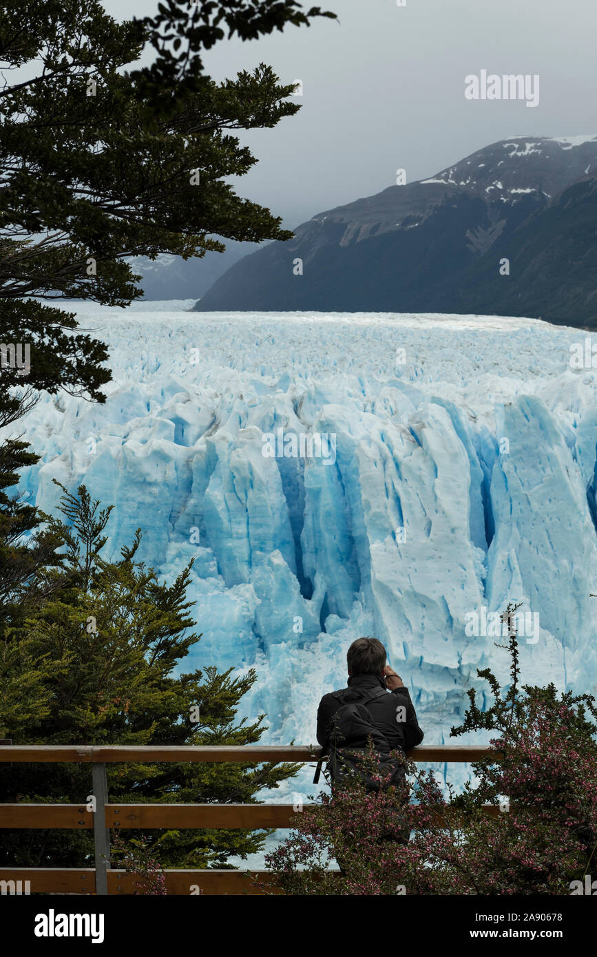 Image of a person watching the glaciers in Perito Moreno, Patagonia Argentia Stock Photo