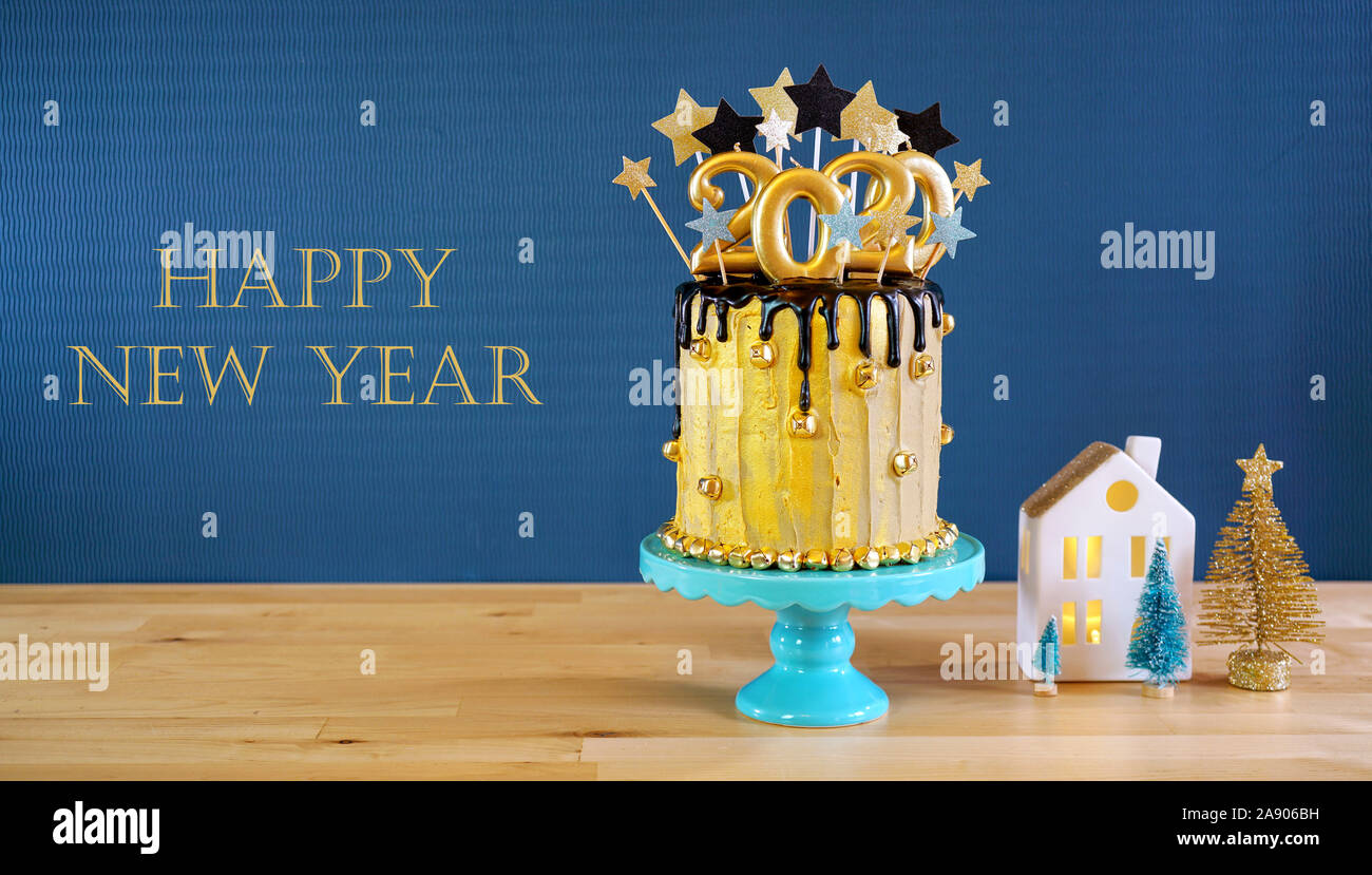 Happy New Year's Eve 2020 black and gold drip cake on a modern ...