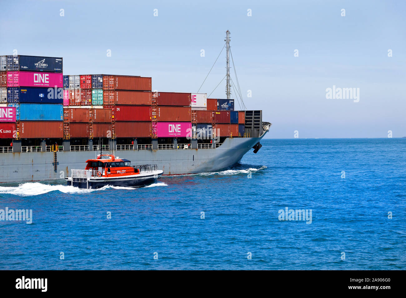 Container ship Swan River Bridge, leaving Fremantle Harbour under Pilot Boat escort, Western Australia Stock Photo