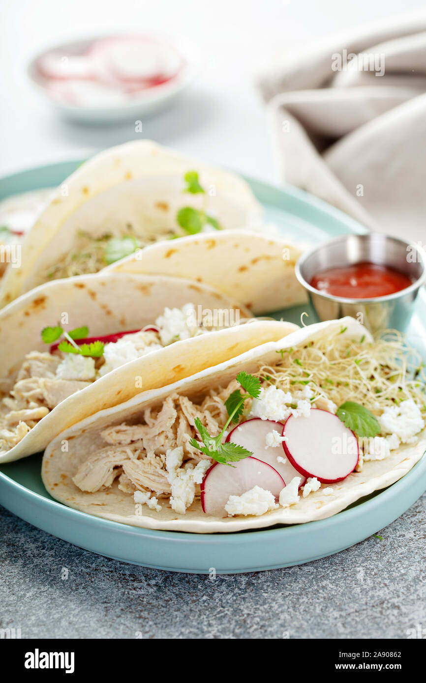Healthy tacos with shredded chicken, radishes and cheese Stock Photo