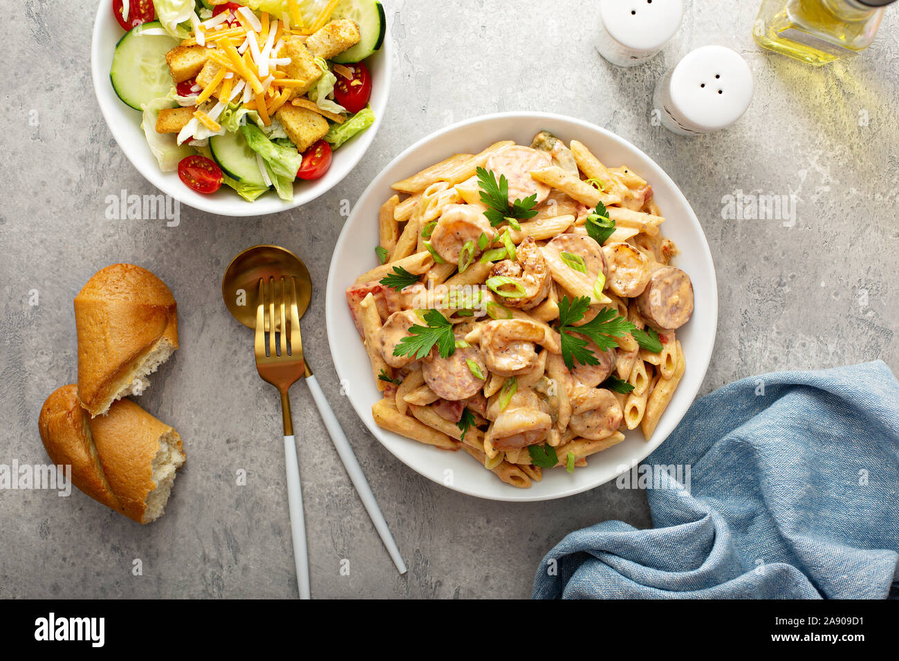 Cajun shrimp and sausage penne pasta in a bowl Stock Photo