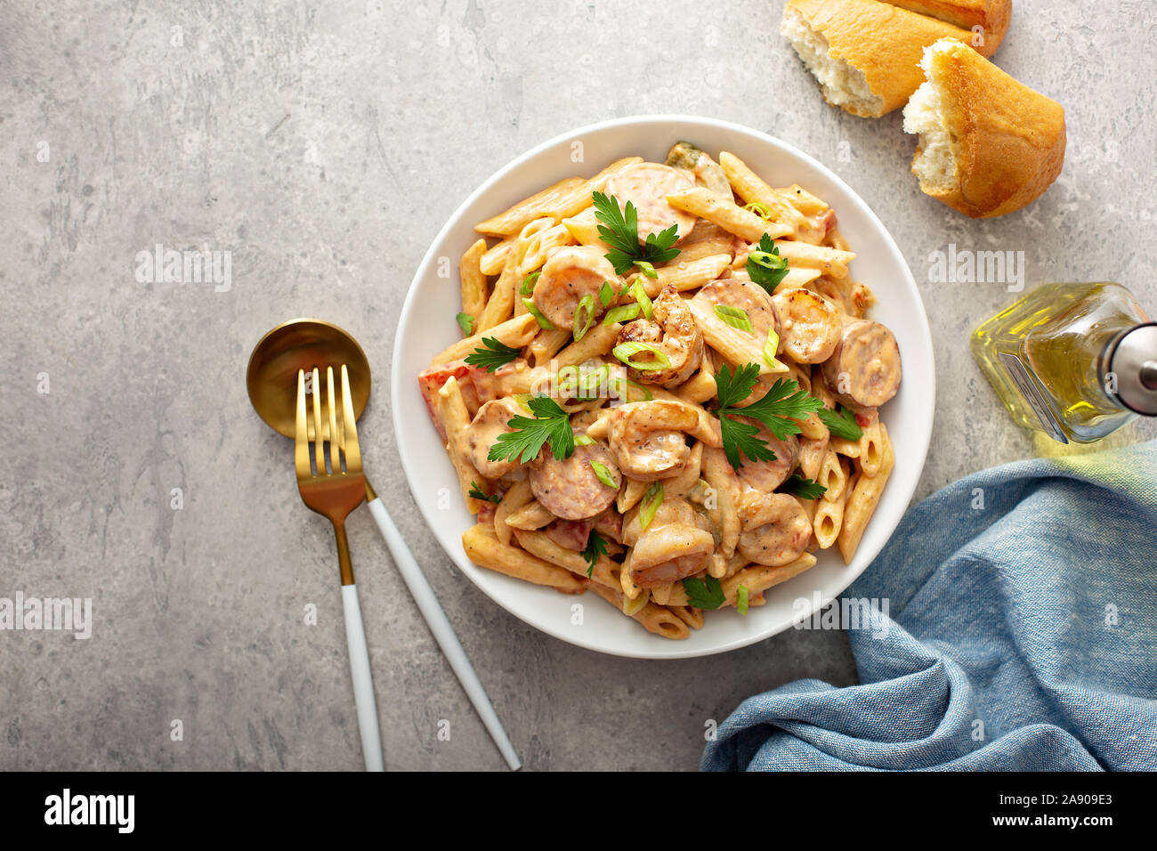 Cajun shrimp and sausage penne pasta in a bowl Stock Photo