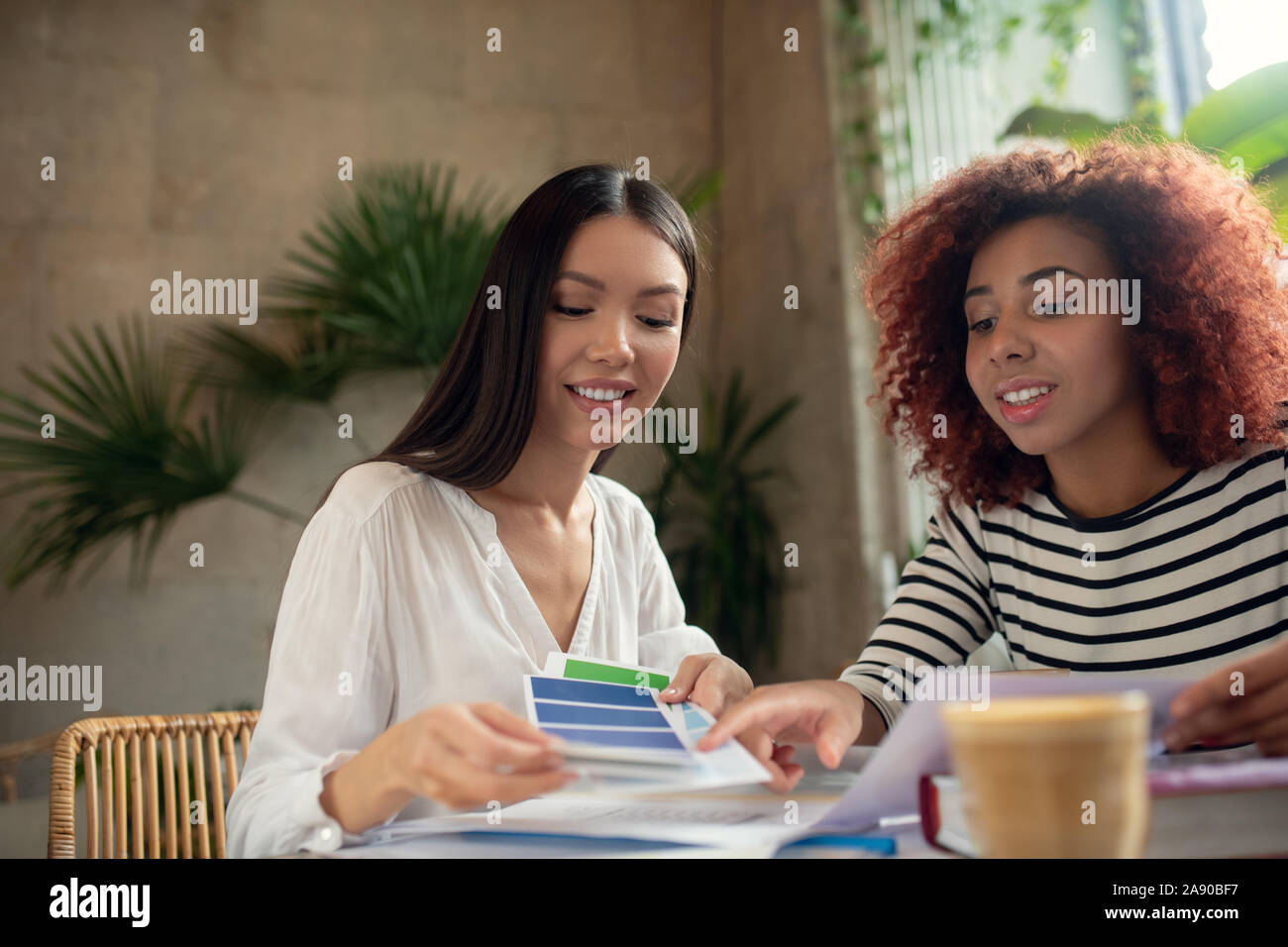 Two promising interior designers discussing new project Stock Photo