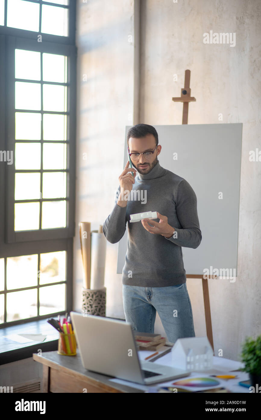 Interior Designer Calling Client While Having Questions