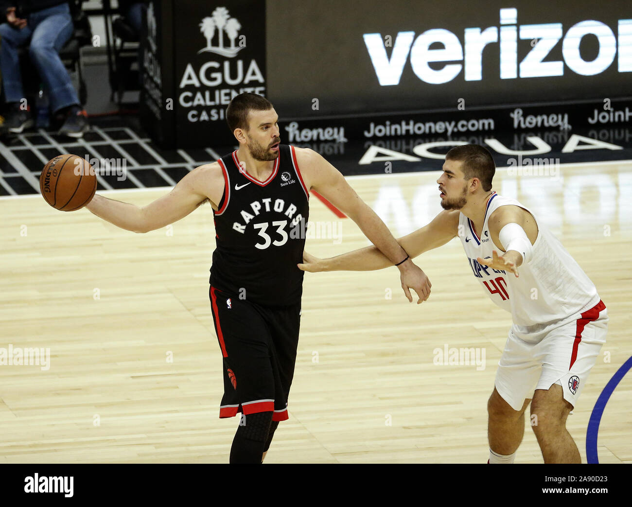Los Angeles, California, USA. 11th Nov, 2019. Toronto Raptors' Marc Gasol (33) is defended by Los Angeles Clippers' Ivica Zubac (40) during an NBA basketball game between Los Angeles Clippers and Toronto Raptors, Monday, November 11, 2019, in Los Angeles. Credit: Ringo Chiu/ZUMA Wire/Alamy Live News Stock Photo