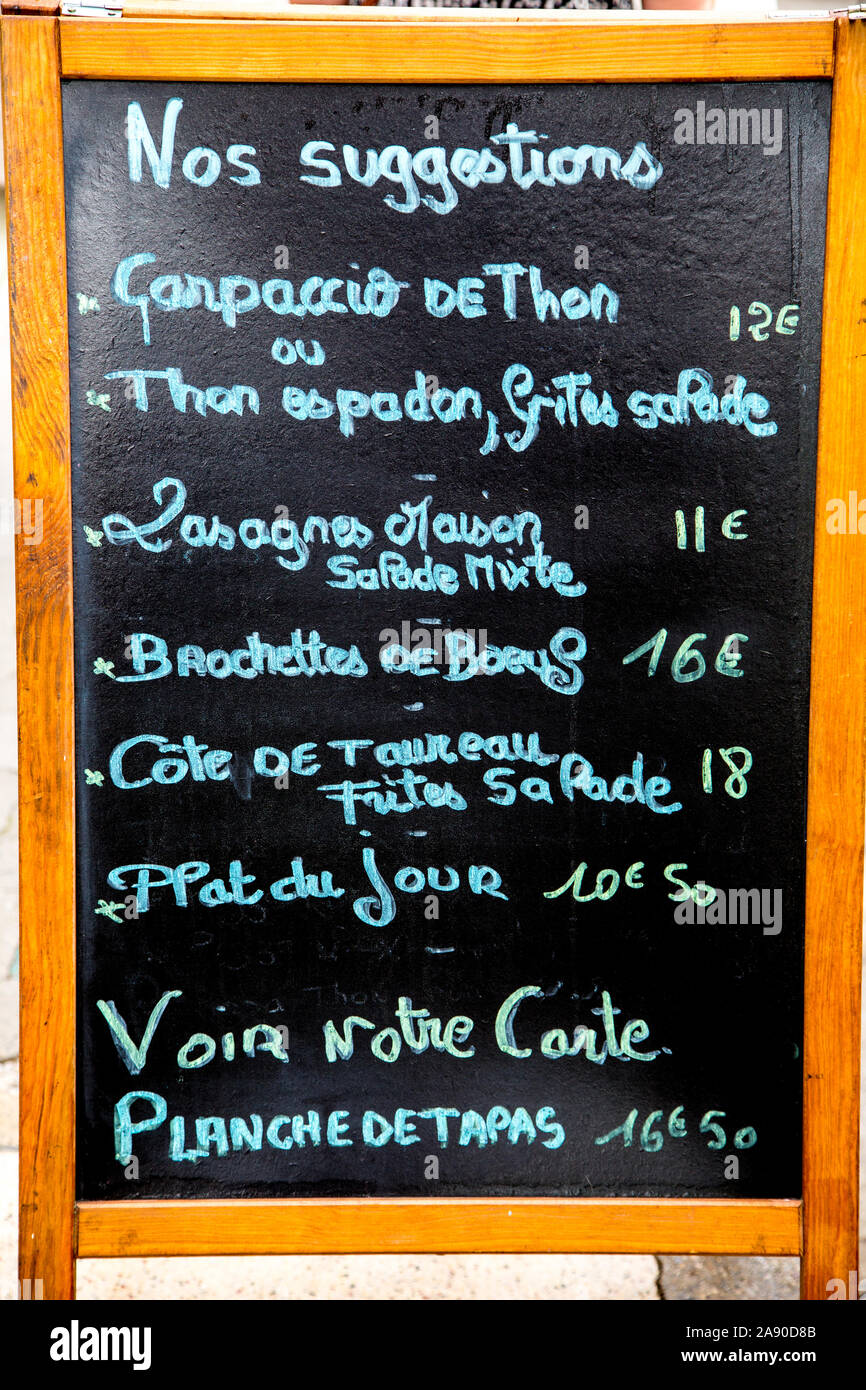 Blackboard with menu suggestions outside a restaurant in France. Stock Photo