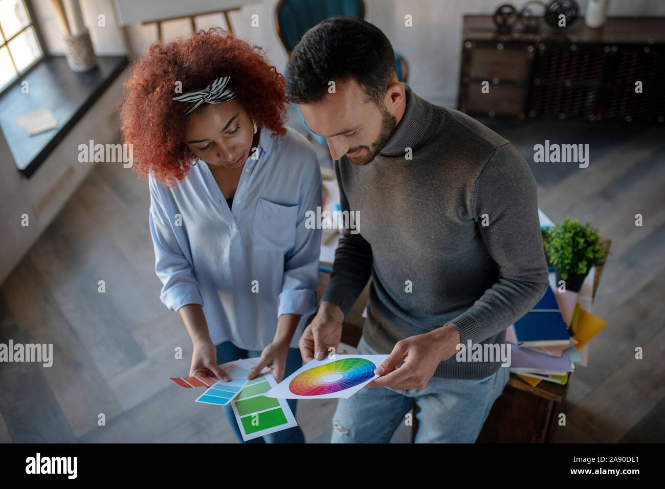 Two talented interior designers choosing color for project Stock Photo