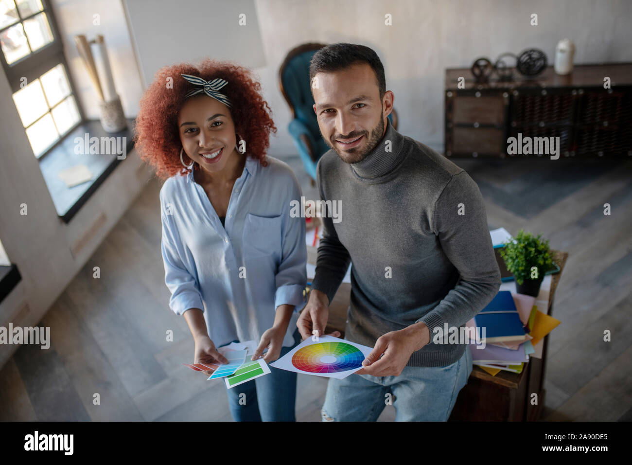 Cheerful interior designers feeling inspired for project Stock Photo