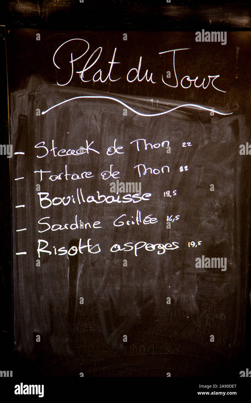 Blackboard with the Plat du Jour outside a restaurant in France. Stock Photo