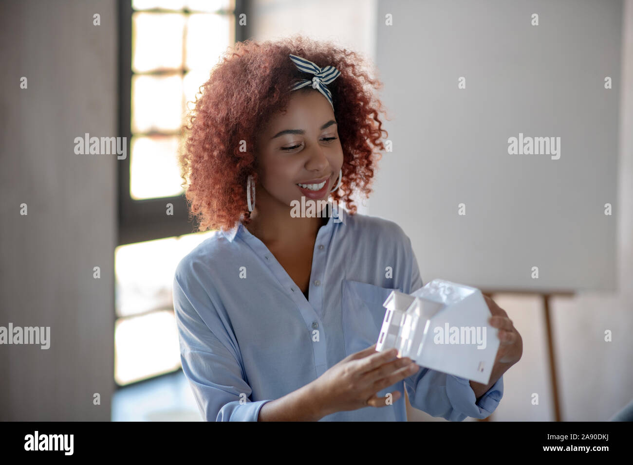 Interior designer smiling while feeling excited before work Stock Photo