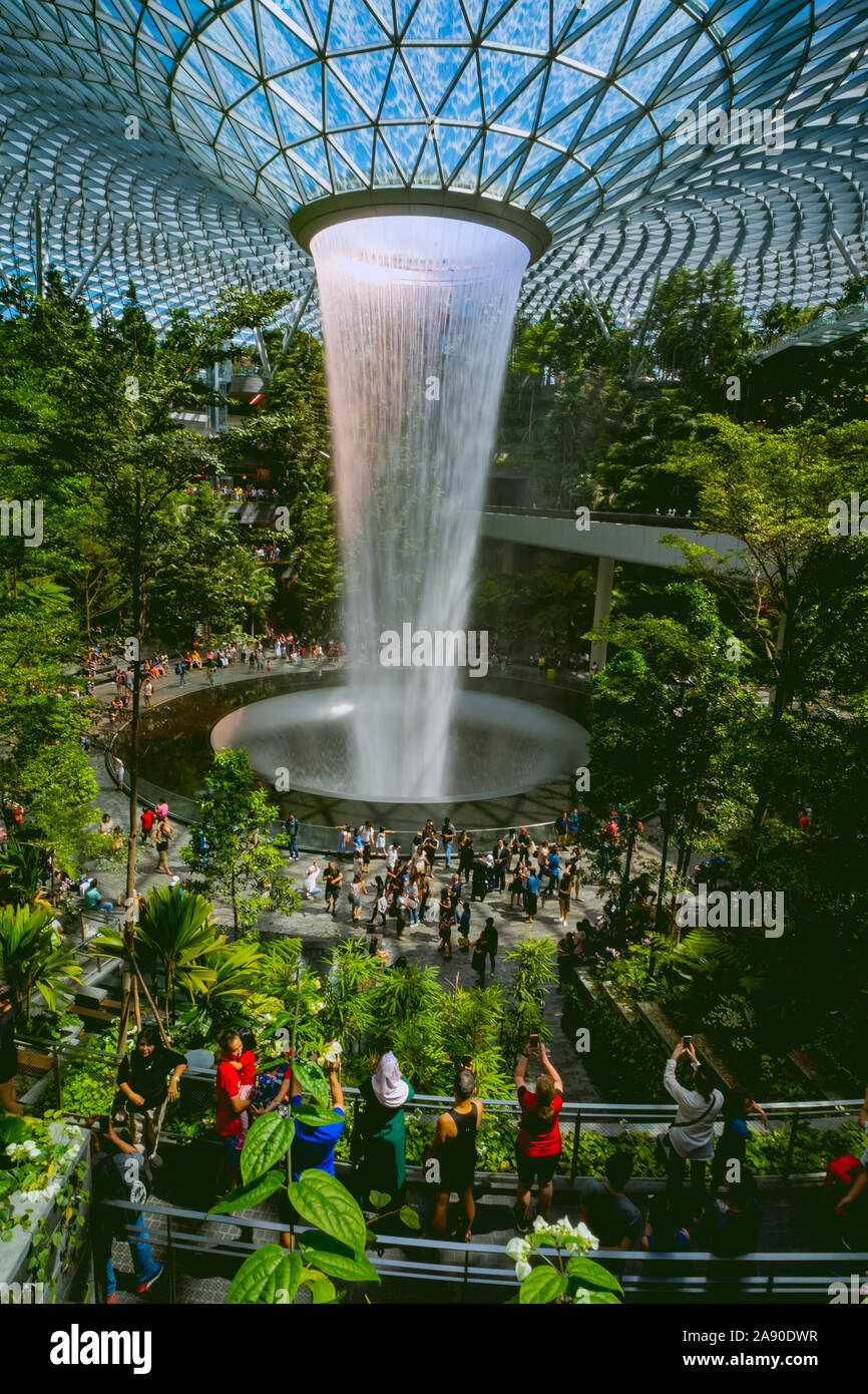 The Rain Vortex is the centrepiece of Jewel Changi Airport. This architectural marvel is the world's highest indoor waterfall within a forest setting, Stock Photo