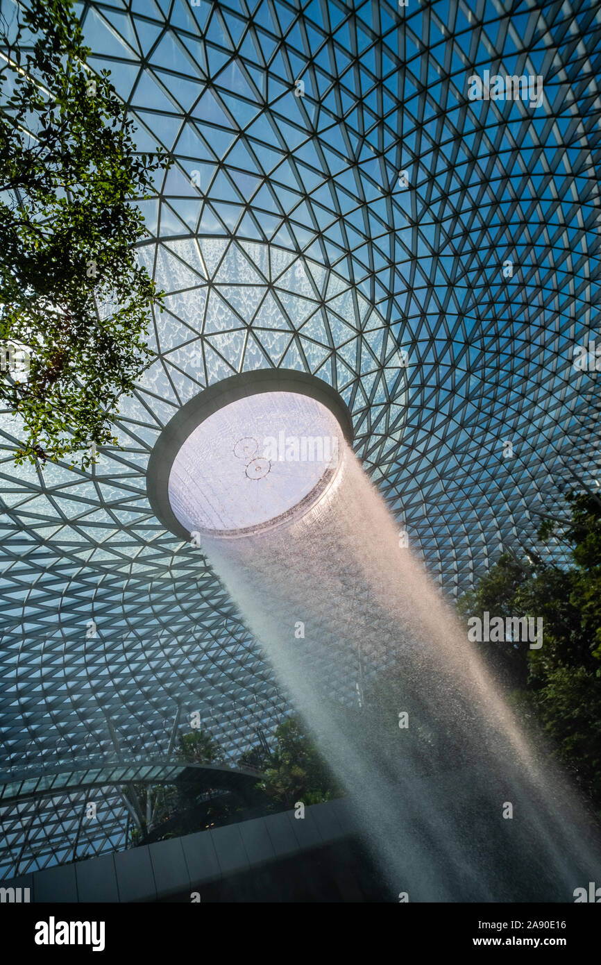 The Rain Vortex is the centrepiece of Jewel Changi Airport. This architectural marvel is the world's highest indoor waterfall within a forest setting, Stock Photo