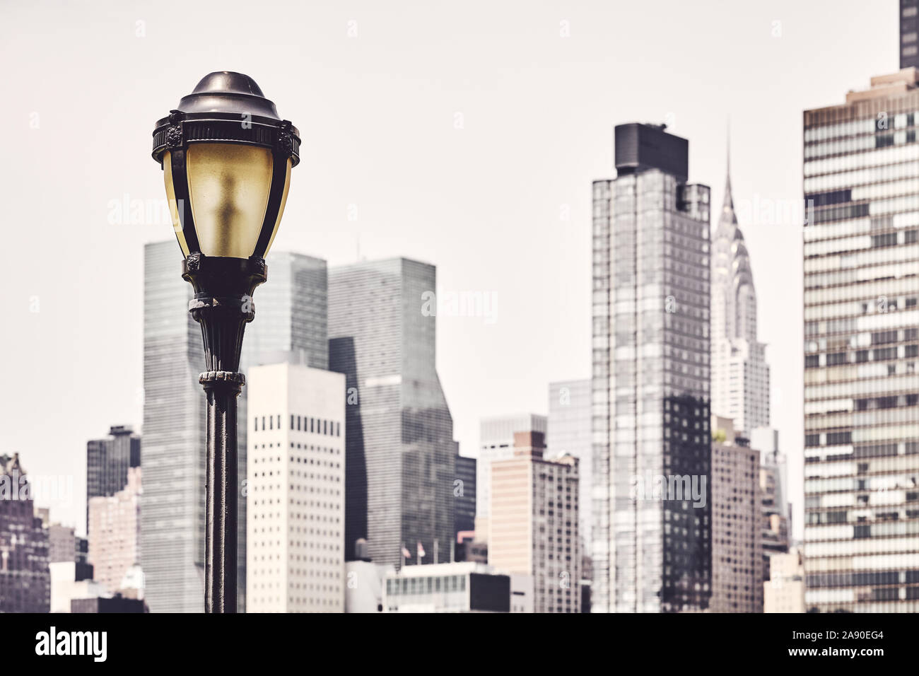 Retro toned picture of a street lamp with New York City blurred skyline in  background, USA Stock Photo - Alamy