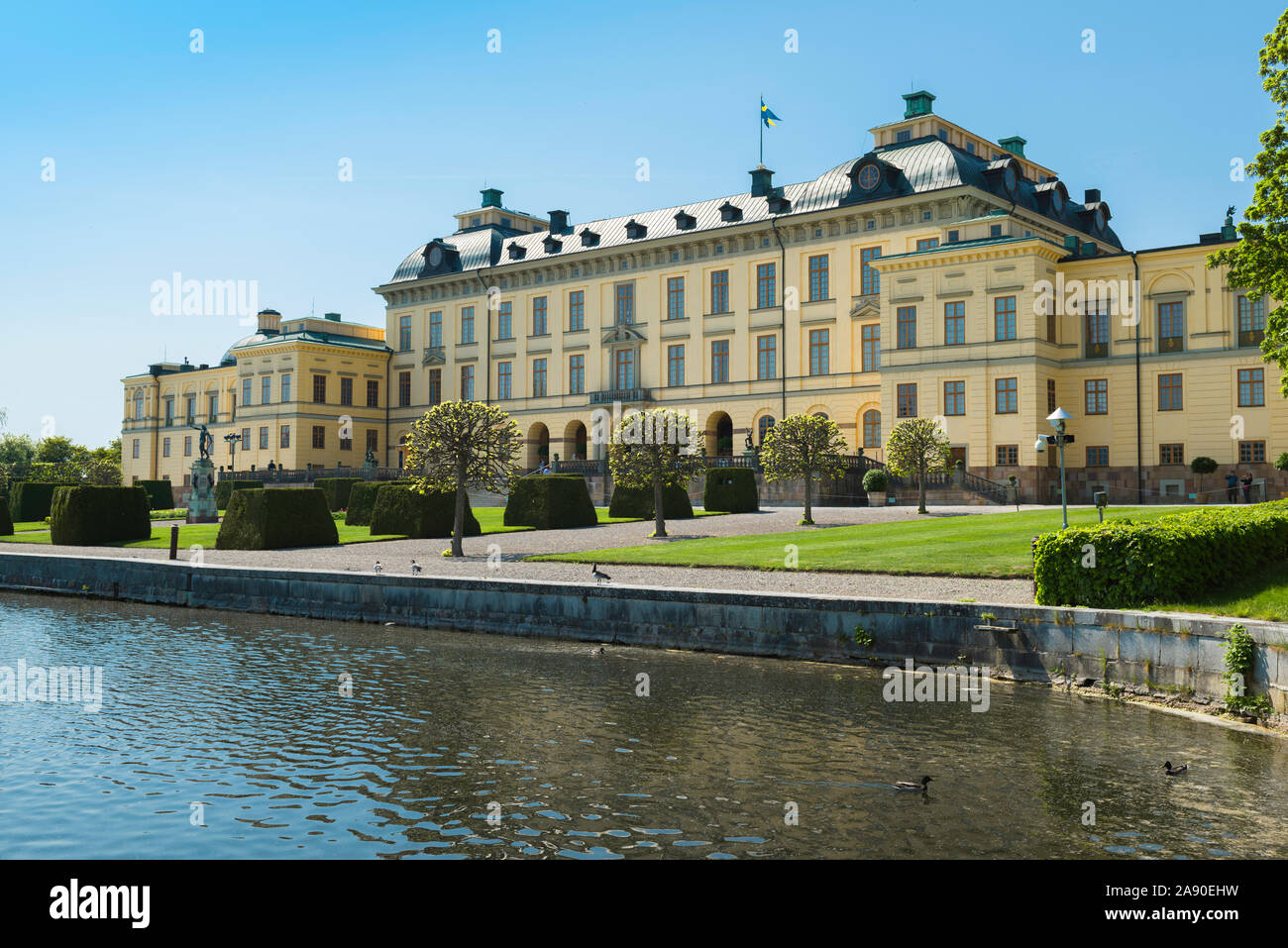 Sweden Drottningholm Palace, view in summer of the east front of Drottningholm Palace with Lake Malaren in the foreground, Lovön island, Sweden. Stock Photo