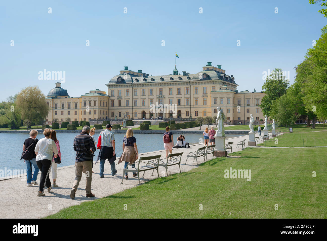 Tourism Europe, view in summer of tourists approaching the Swedish Royal Palace - Drottningholm (Drottningholms Slott) - on Lovön island, Sweden. Stock Photo