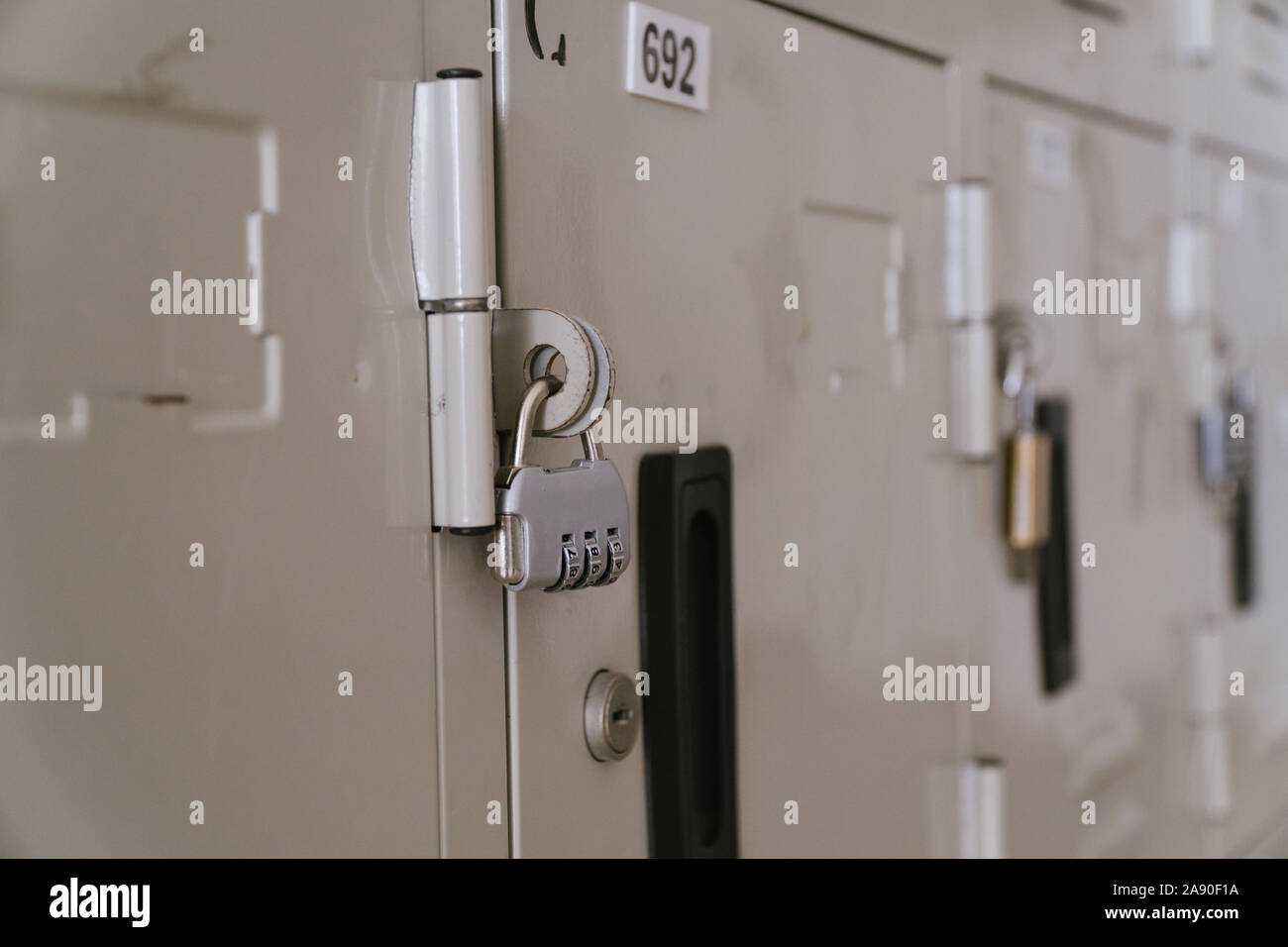 Line of lockers with the lock in the hallway of campus in primary school Stock Photo