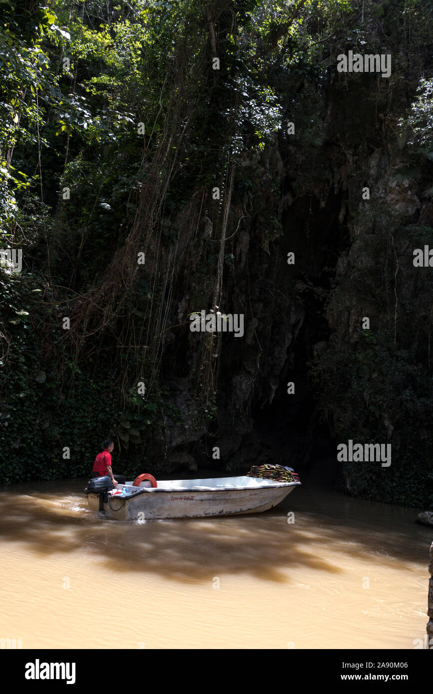 A tourist-carrying boat at the entrance of the Cueva del Indio (Indian cave).   The Cueva del Indio was first discovered in 1920. It has a flowing u Stock Photo