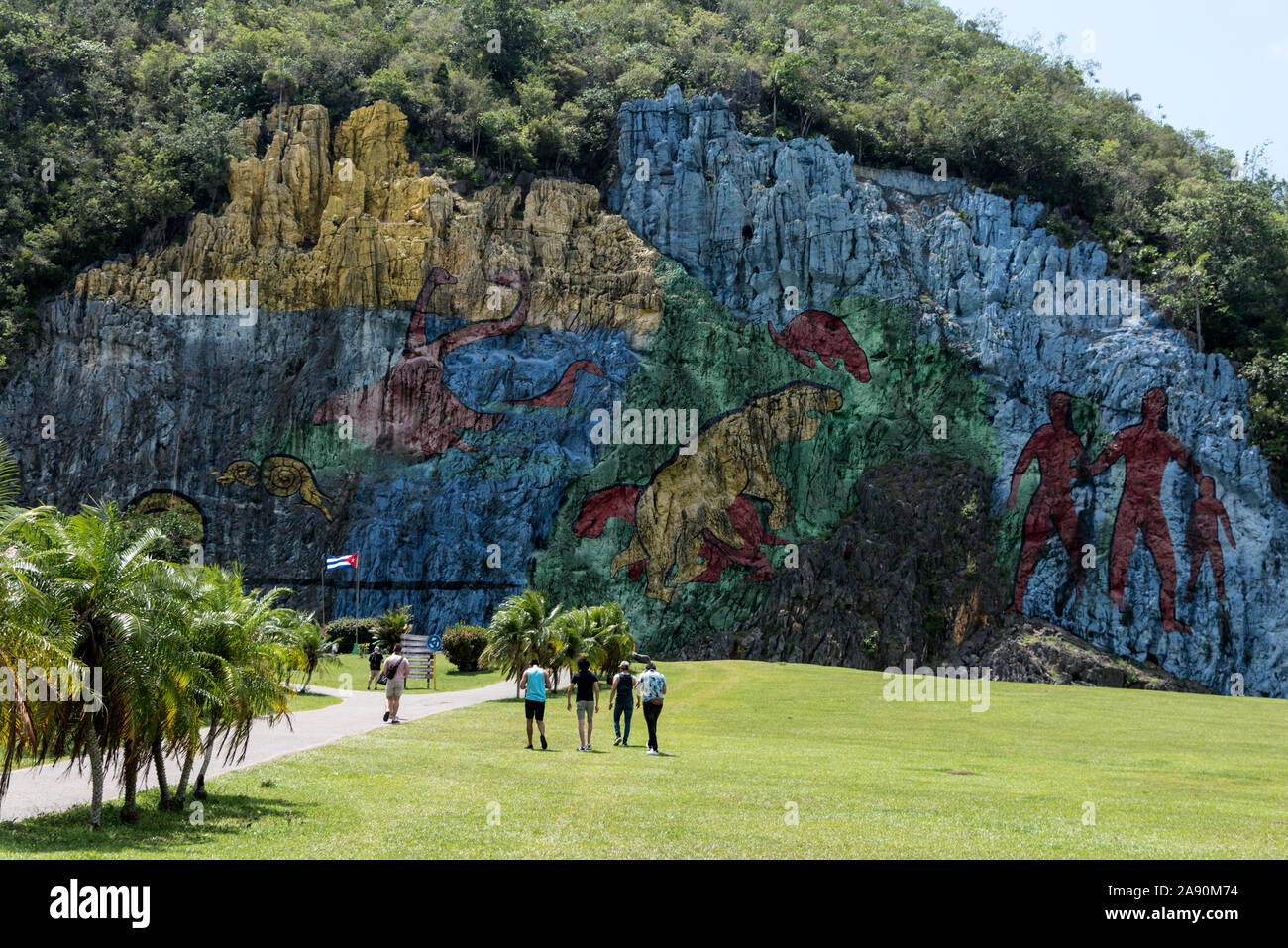 The Mural of Prehistory covering a cliff face at the Restaurant Mural de la Prehistoria, Dos Hermanas near the town of Vinales, in the Pinar del Río P Stock Photo