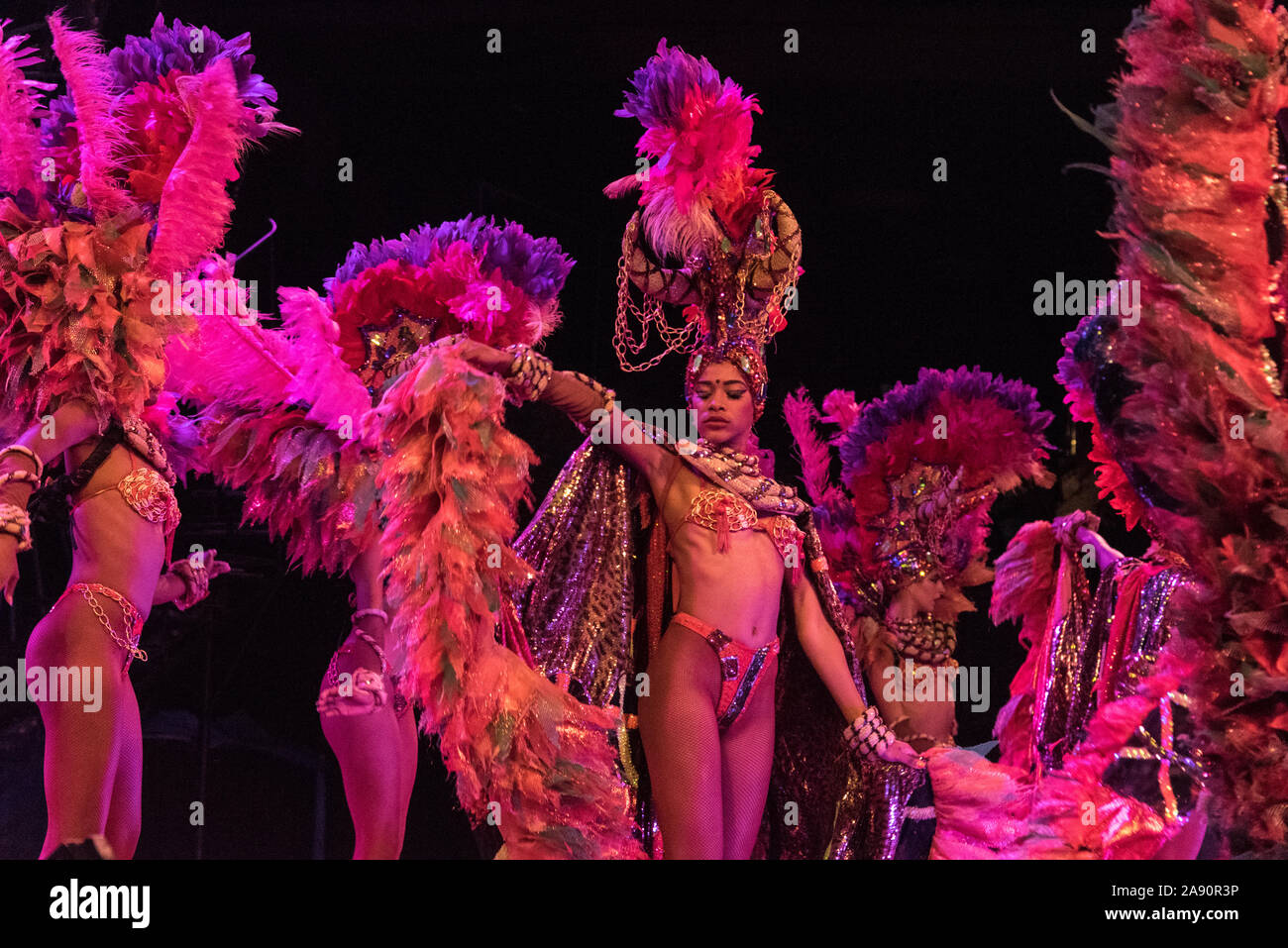 A troupe of dancers performing  on an open-air stage in front of diners at  the Tropicana night club outside Havana in Cuba Stock Photo